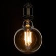 GloboStar® 99044 Λάμπα LED Long Filament E27 G125 Γλόμπος 12W 1080lm 360° AC 220-240V IP20 Φ12.5 x Υ18cm Ultra Θερμό Λευκό 2200K με Μελί Γυαλί - Dimmable - 3 Years Warranty